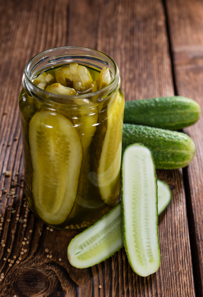 Portion,Of,Sliced,And,Pickled,Cucumbers,(close-up,Shot),On,Wooden