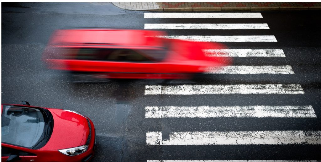 two red cars pedestrian