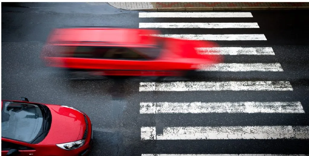 two red cars pedestrian