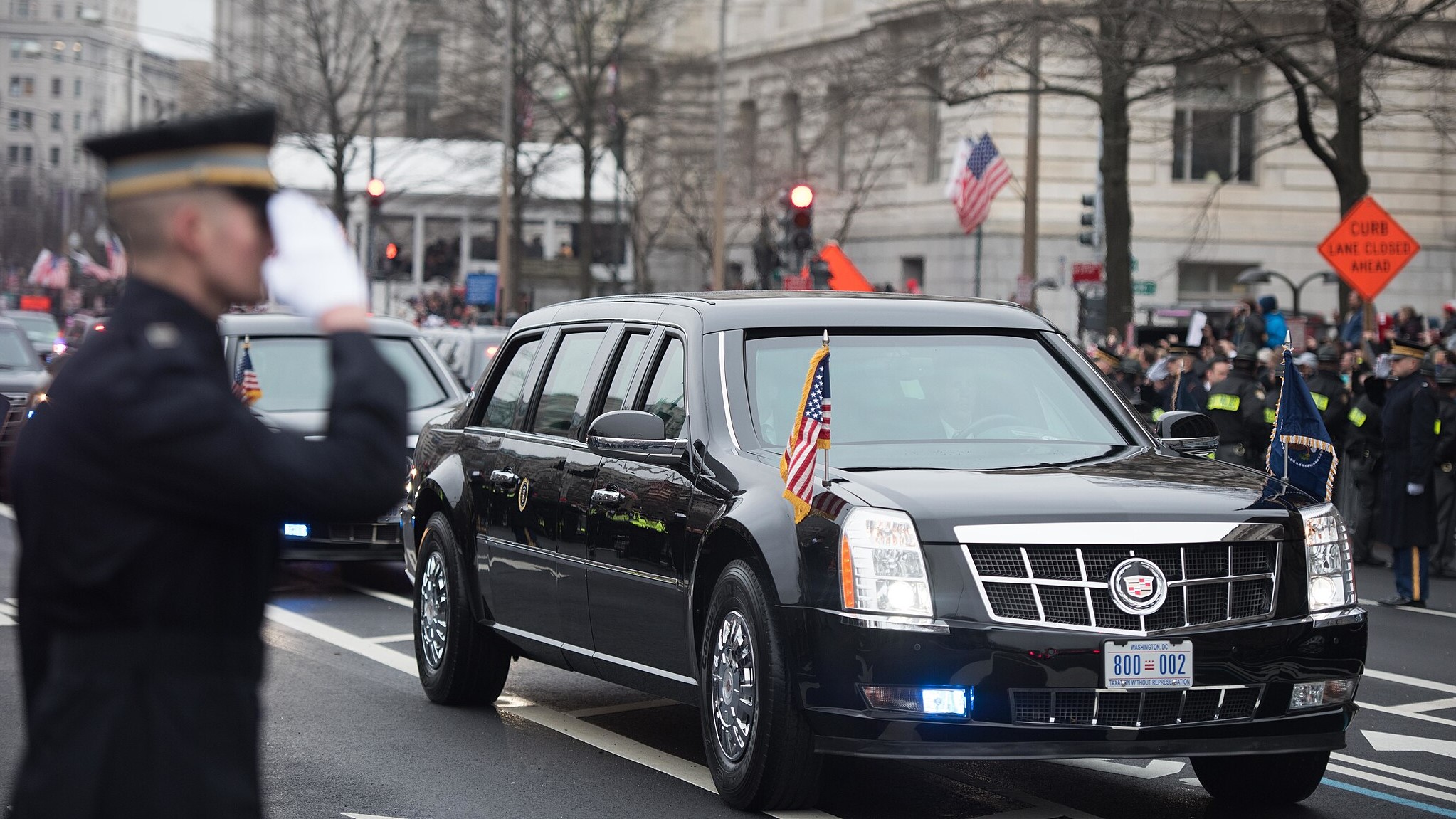 A soldier from the 3d Infantry Regiment (The Old Guard) salutes President Trump