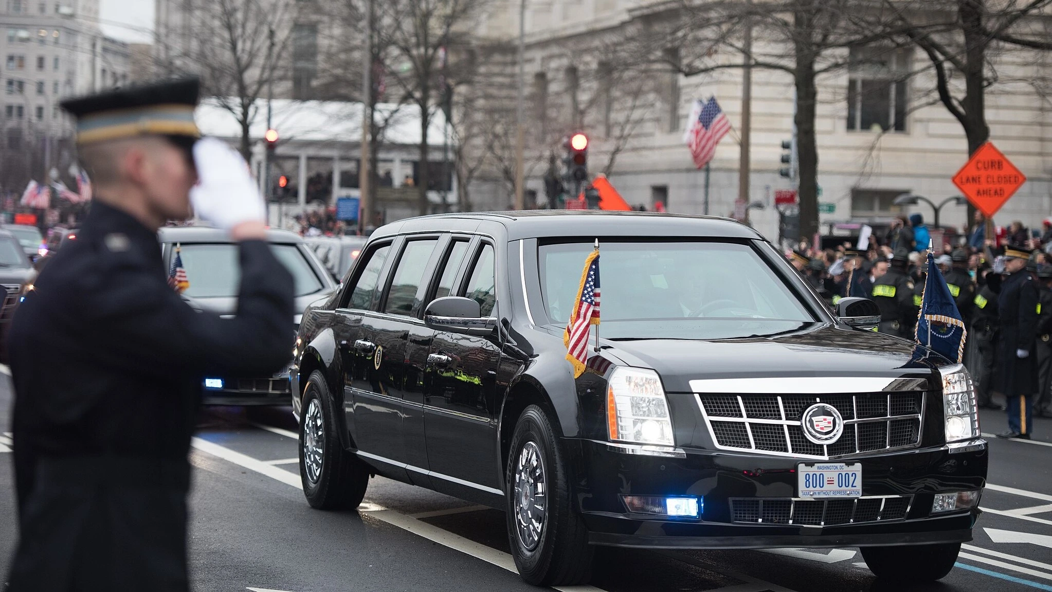 A soldier from the 3d Infantry Regiment (The Old Guard) salutes President Trump