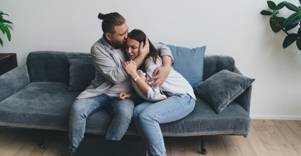 Couple talking, crying