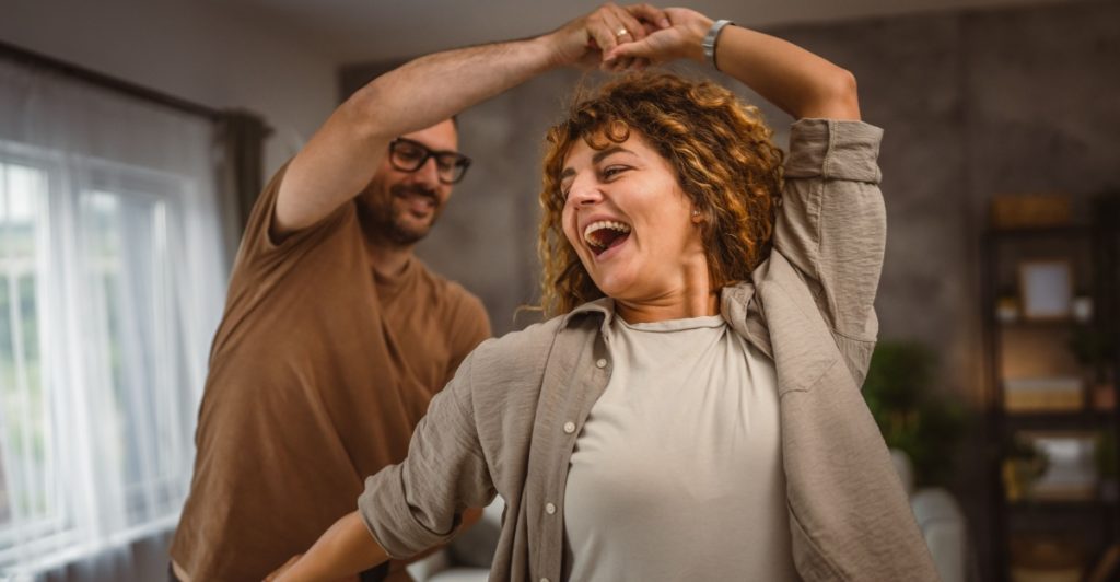 Dancing, happy couple