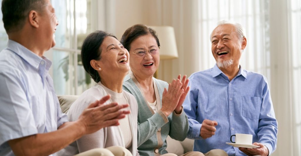 Happy friends, eldery couple