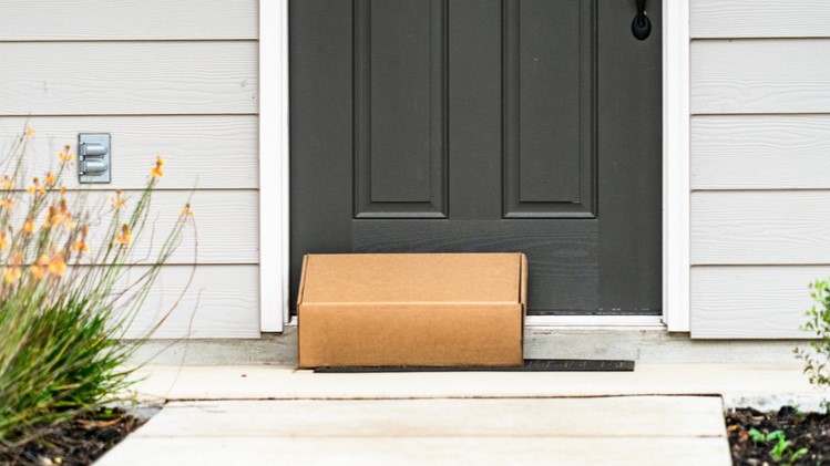 package sitting at front door at house home