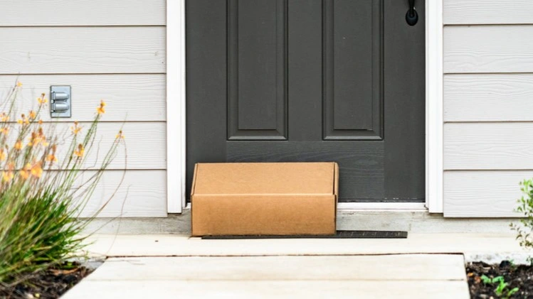 package sitting at front door at house home