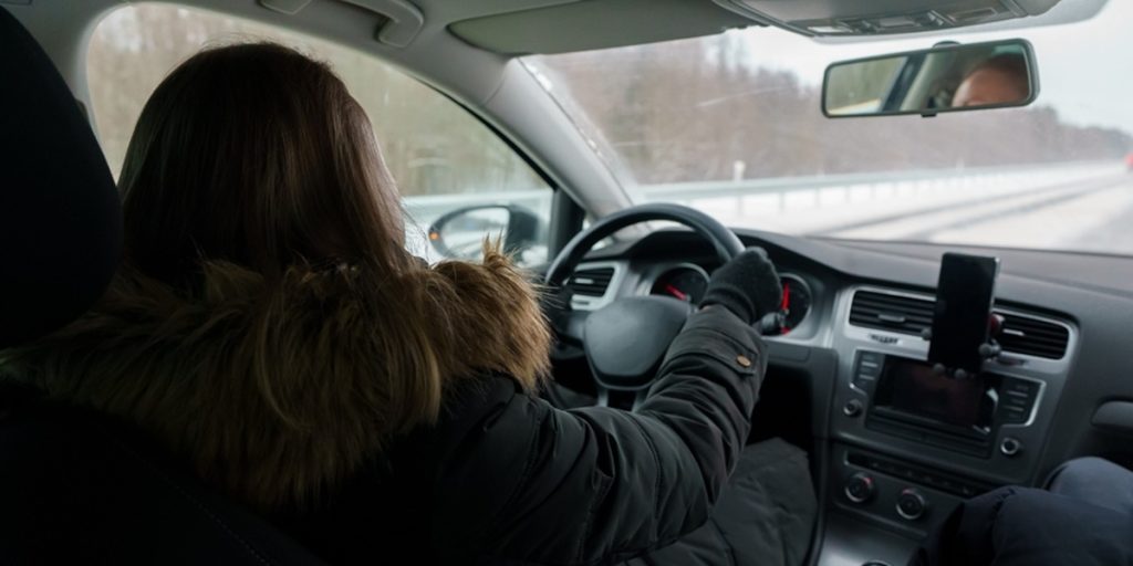 Woman,Driving,A,Car,In,Winter,Time.