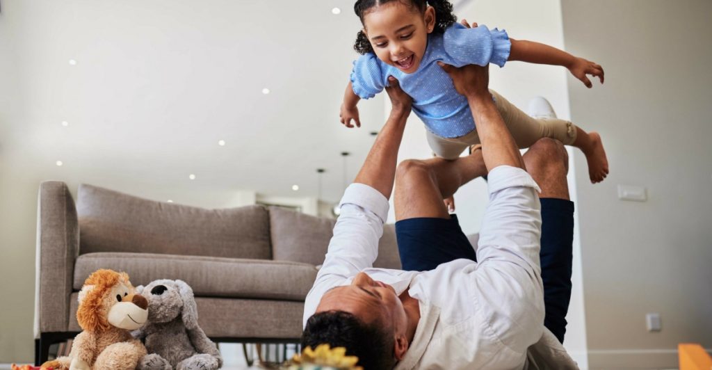 Father and child playing, parent
