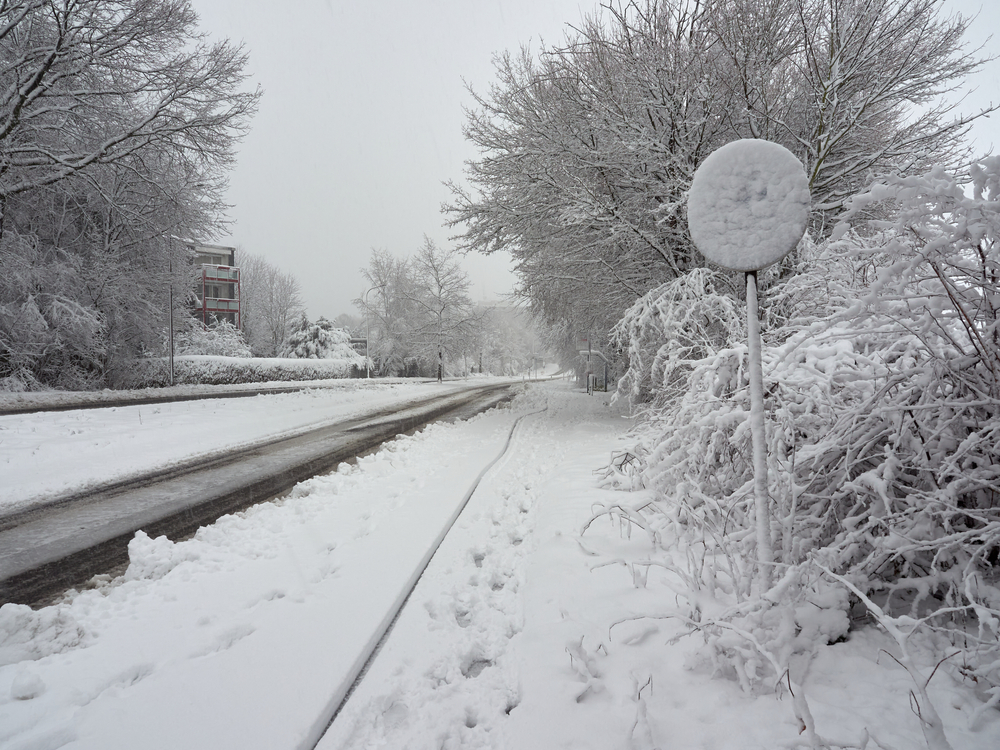 Snow-covered,Roads,And,Pavements.,Road,Sign,Covered,With,Snow.,Winter