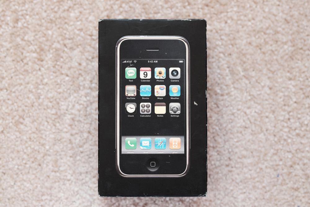 Editorial photo of the first generation Apple iPhone in original box, iconic 2007 smartphone