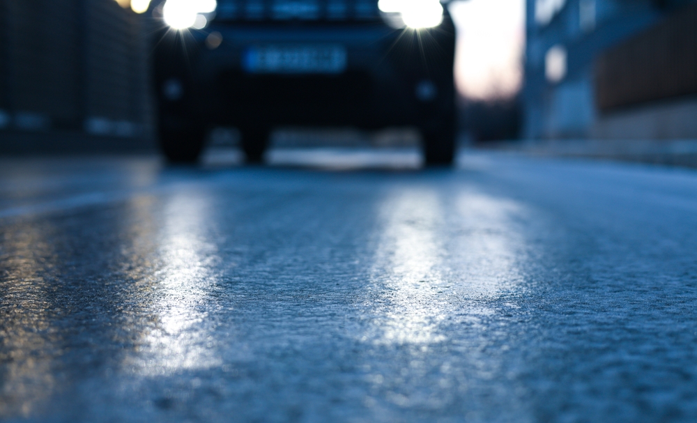 Icy road, is på vej, car on road, ice, skidding on ice, slippery, glat, Glazed frost on the asphalt. icy road danger for driving