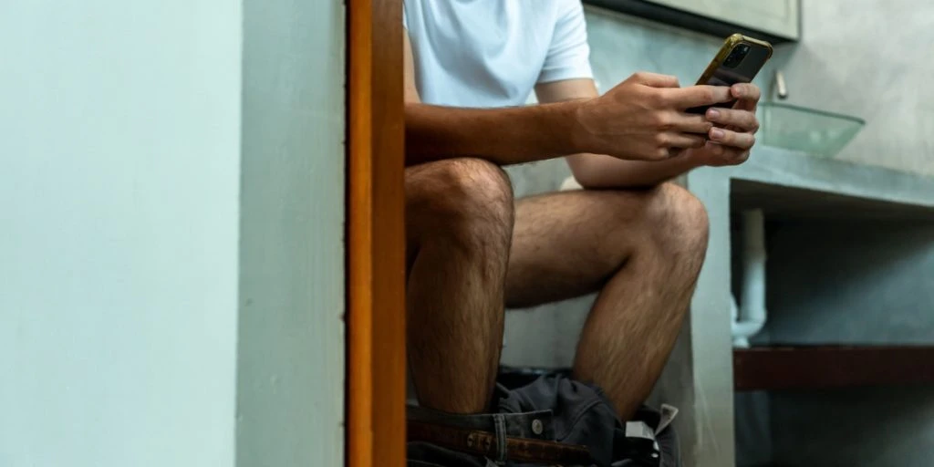 Using your phone on the toilet? A study says it could increase a painful health risk