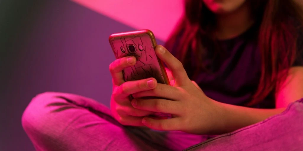 Teenage girl with smartphone mobile phone