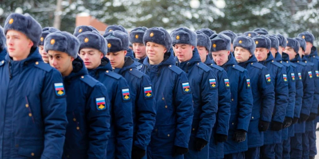 Russian conscripted men at a soldiers recruiting office during Russia's military mobilization