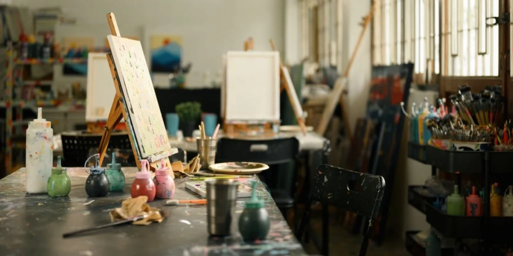 Creative Art Studio with Painting Supplies and Easels, Artistic Workspace Concept