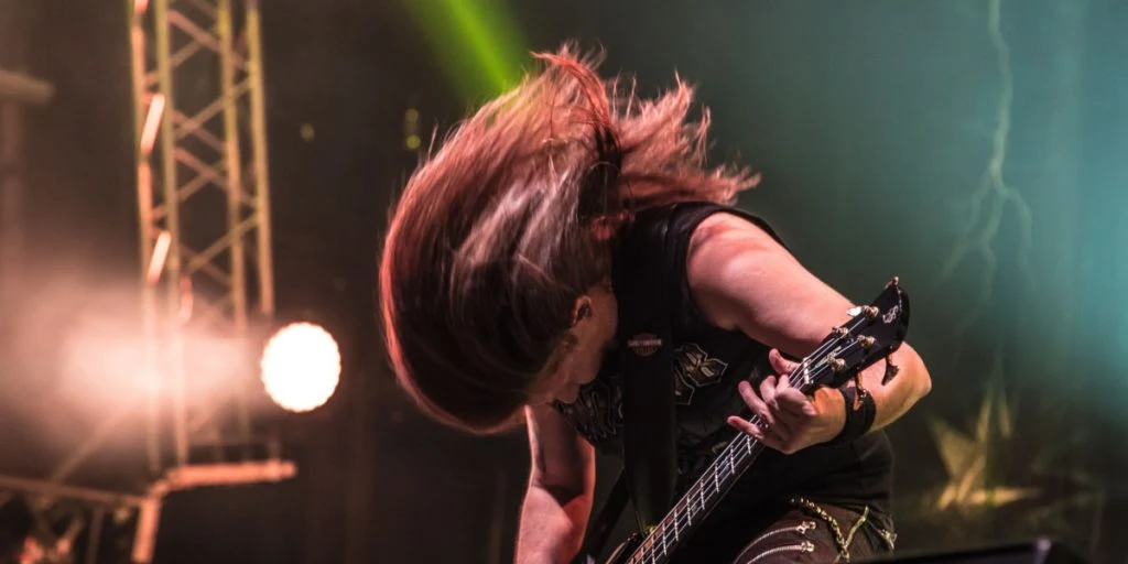 Bass guitar playing rock heavy metal long hair headbang