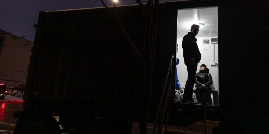 dark container, people entering, ukraine