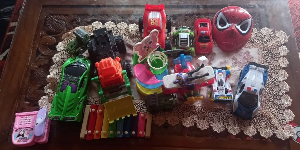 A pile of children's toys on a table