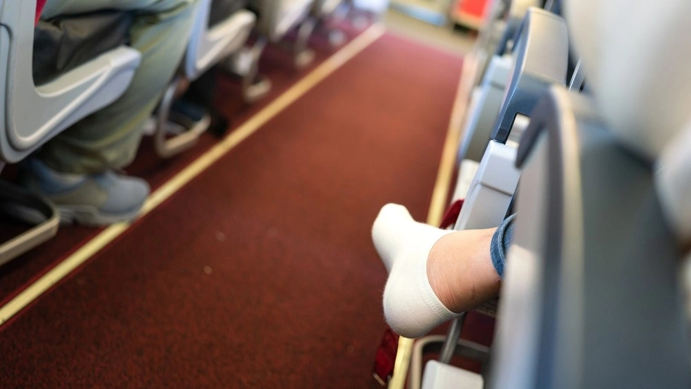 Why wearing black socks on a plane could be risky