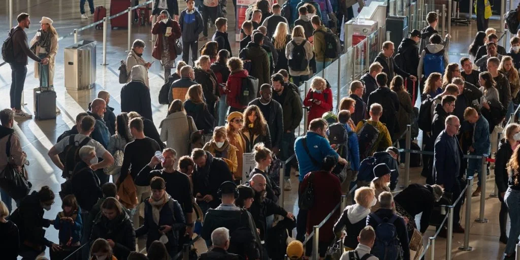 People standing in line at airport queue