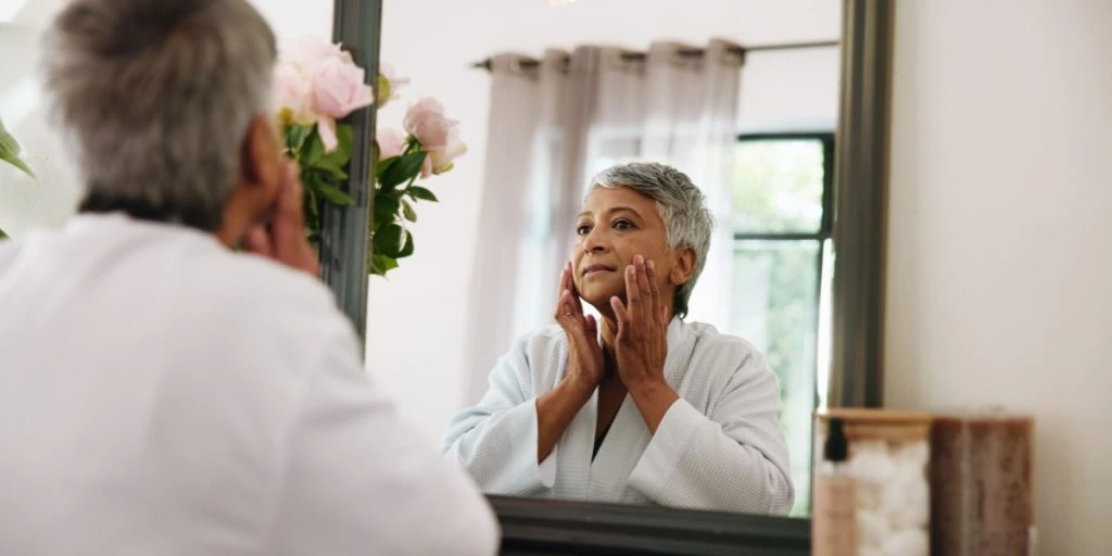 Woman looking in mirror