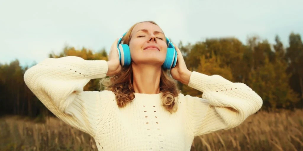 Woman listening to music happy headphones