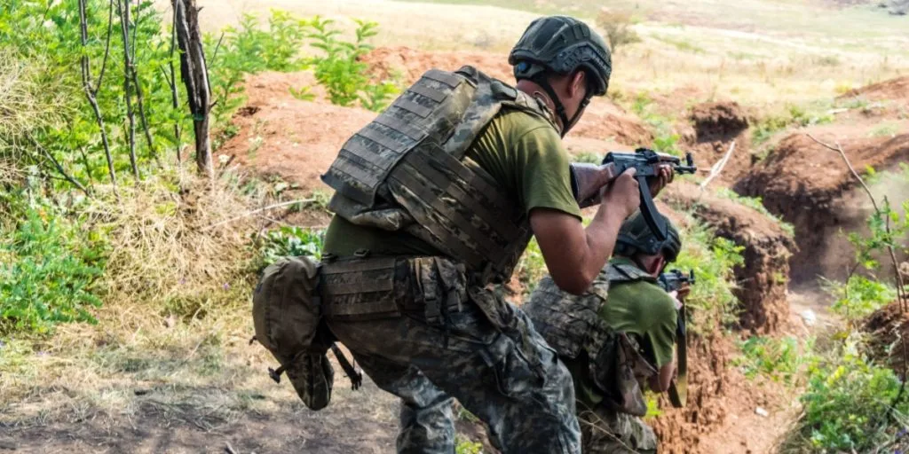 Ukrainian soldiers train in various combat techniques. They practice shooting exercises and trench warfare