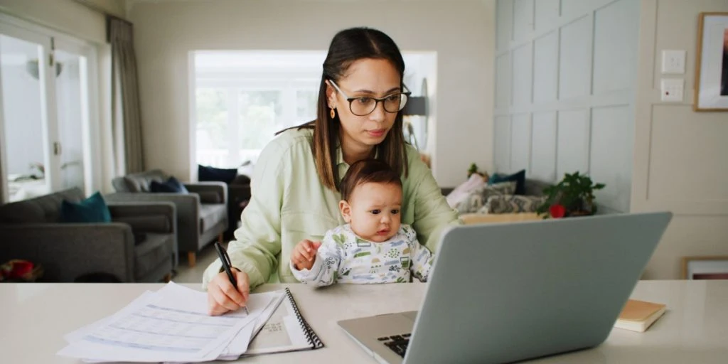 remote work and woman with baby on laptop