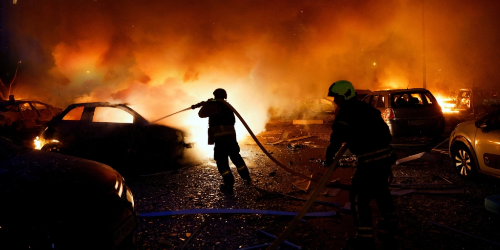 Ille-sur-Tet, Pyrenees-Orientales, France - July 6, 2026: Firefighters respond to a wildfire near Ille-sur-Têt, close to Perpignan, as a burned car is seen in the affected area in the Pyrenees-Orientales region of southern France.