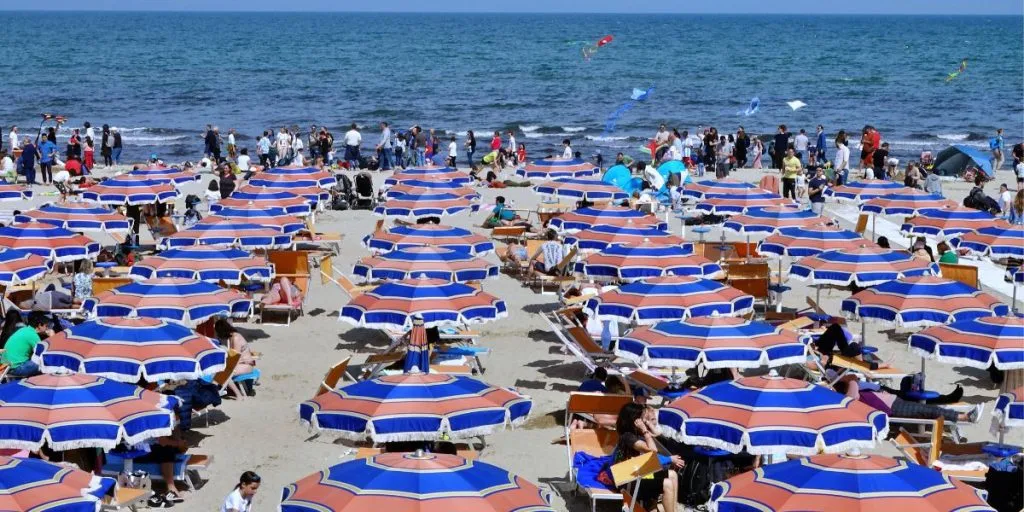 aerial view of Rimini beach in Italy full of umbrellas and tourists