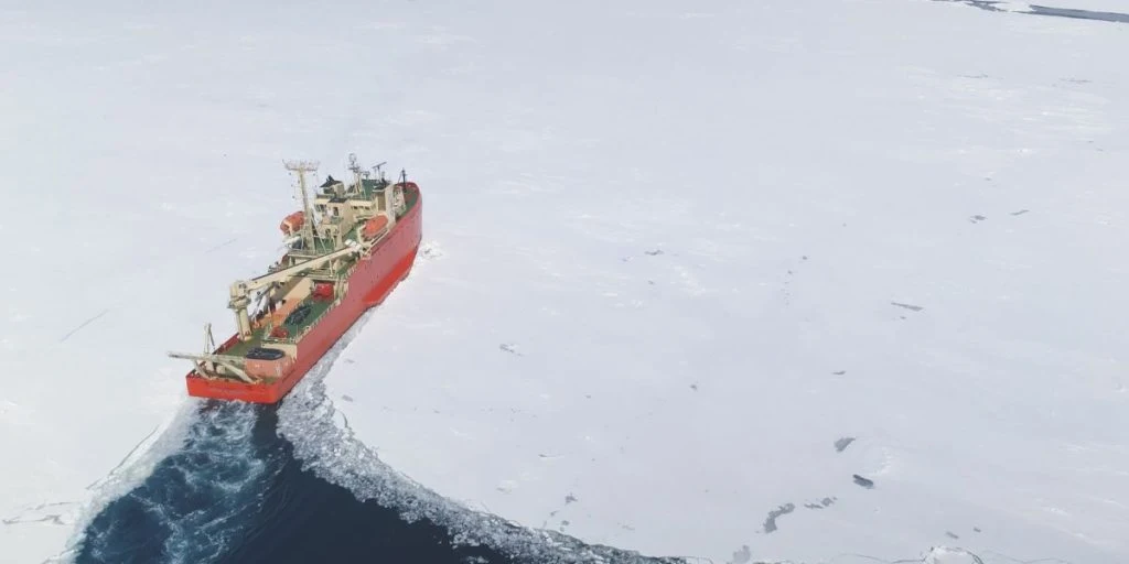 Icebreaker breaks through pack ice on its way