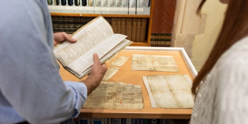Researchers examine medieval manuscript fragments at Guernsey’s Island Archives