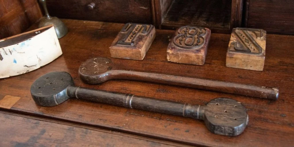 Objects used in punishment, wooden paddles to hit the palms of the hands