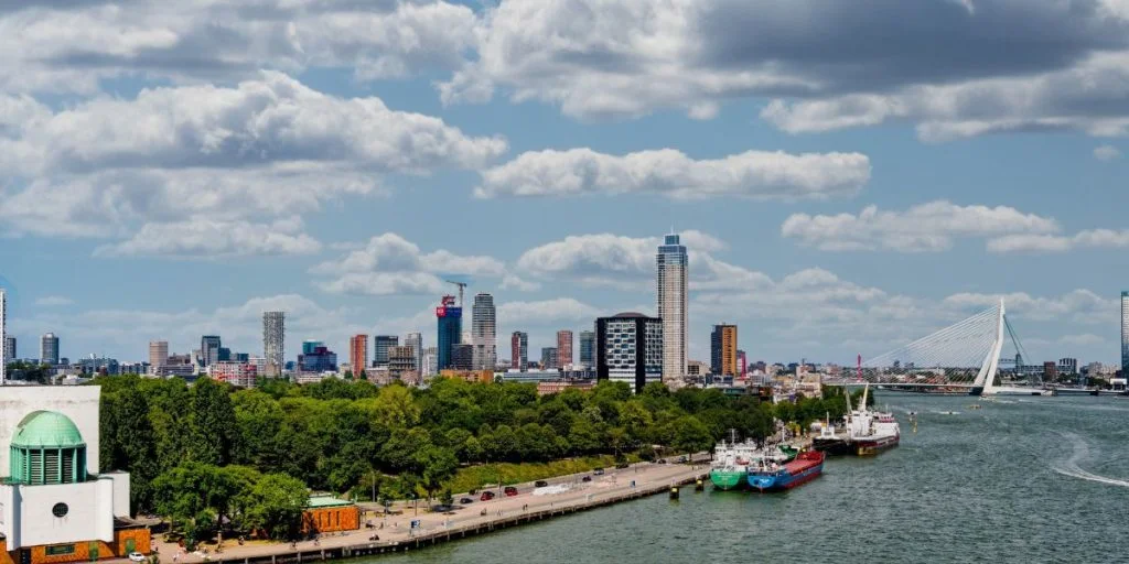 Rotterdam skyline along the Nieuwe Maas, led by the 215-meter-high Zalmhaventoren, the tallest building in the Netherlands