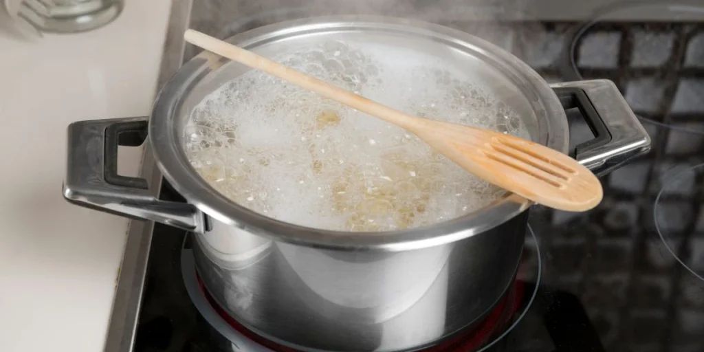 Wooden spoon, boiling water
