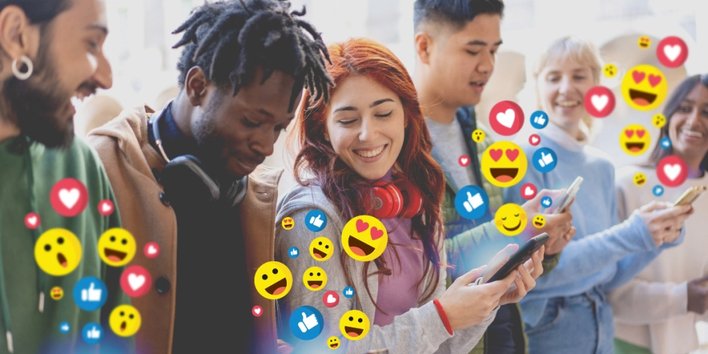 En grupp unga människor som sänder kärleks emojis