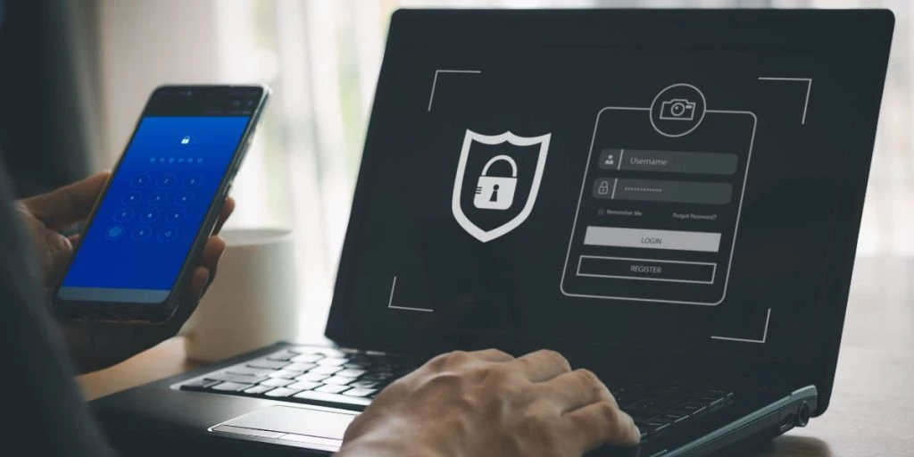 phishing scam, mobile phone hacker, or cyber scam concept. Password and login passcode in the smartphone. Online security threat and fraud. a scammer with cell phone and laptop. Bank account security.