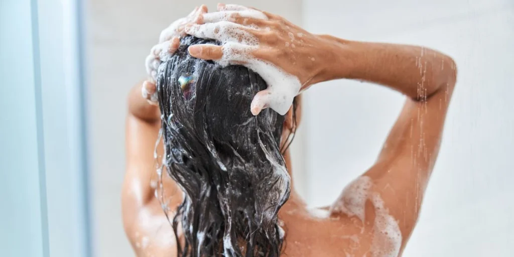 Woman long wet hair, shampoo