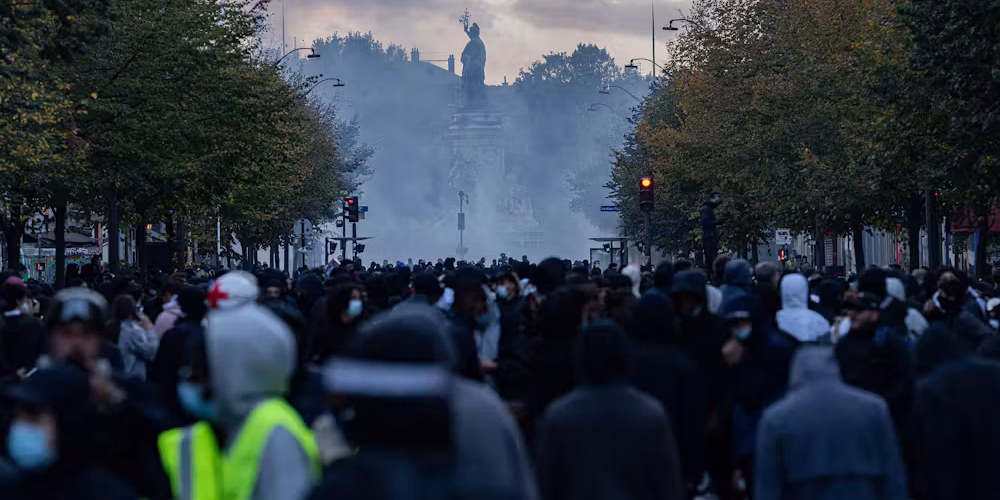 demonstrators gathered around Place de la République amid tear gas