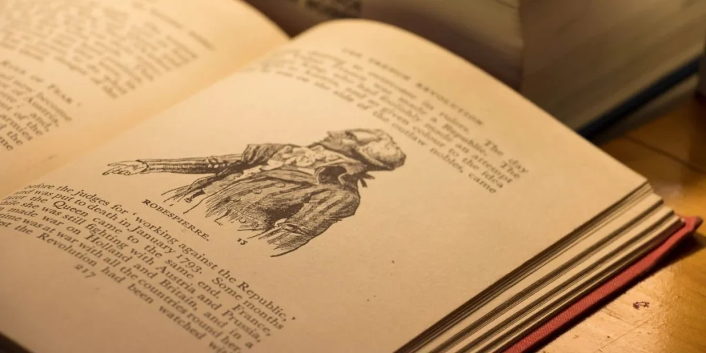 A book on world history, opened to the French Revolution, showing Maximilien Robespierre, leader during the Reign of Terror. The Revolution lasted 1789 to 1799.